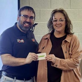 KNCK News & Sports Director Toby Nosker Presents Mrs. Tricia Koester with a Gift Card from Subway of Concordia for Being Named the January 2024 Teacher/Staff Member of the Month