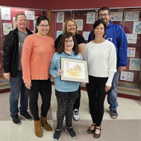 Concordia Fall Fest 4th Grade Button Contest Winner Katelyn Bauer Pictured with Mother Jennifer Bauer, Elementary Art Teacher Shawn Hood, Concordia Chamber of Commerce Director Annie Bergmann, Kindra Hollen, Fall Fest Button Committee Chair, and David Wiesner, Fall Fest Committee Social Media Chair