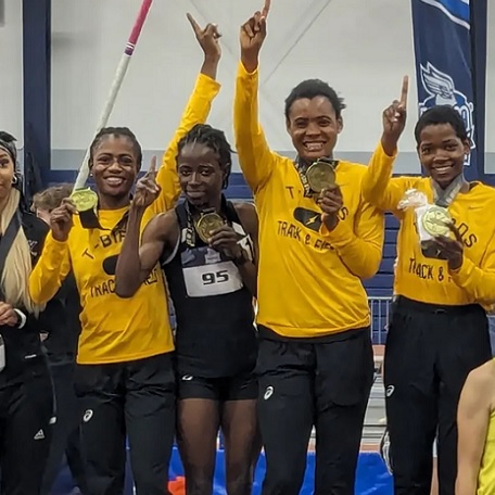 Mercy Angaamchaab, N Vanee Anchike, Rafiatu Nuhu, and Nontokozo Ncube Celebrate their Distance Medley Relay National Championship on the Podium at the 2024 NJCAA Indoor Track and Field Championships in Gainesville, Florida
