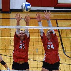 Concordia Senior Shaelin Giersch and Sophomore Kenlee Williams Go Up for a Block